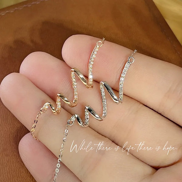 Swirl of Grace necklace - Gold