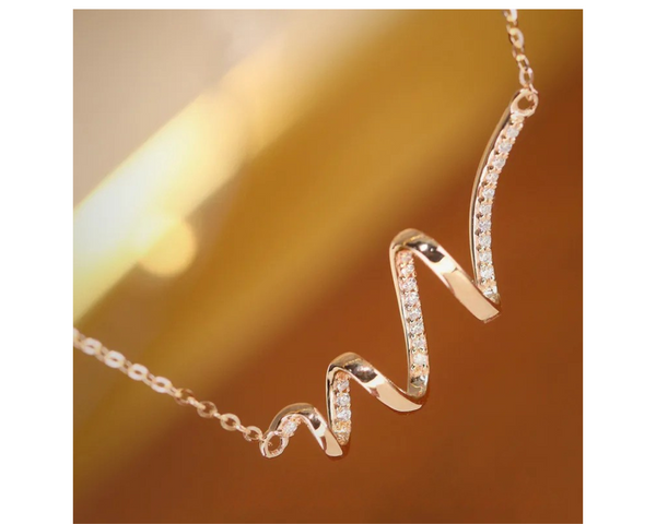 Swirl of Grace necklace - Gold